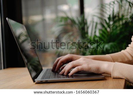 Closeup of copywriters hands typing on laptop computer, editing article for website, working project, sitting at workplace. Programmer writing code. Student studying, online education concept 