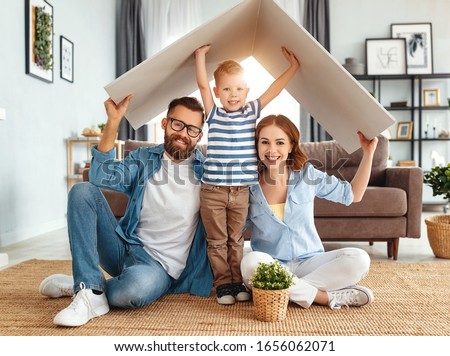 concept housing a young family. Mother father and child in new house with a roof at a home
 Royalty-Free Stock Photo #1656062071