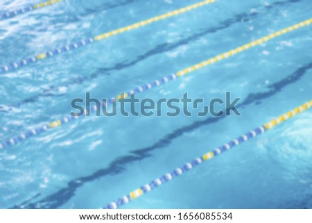 Defocused background with aerial view of a swimming pool with dividers. Intentionally blurred post production for bokeh effect