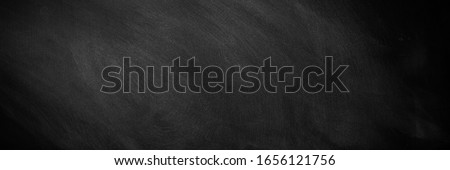 wide Chalkboard texture background. blackboard wall backdrop wallpaper, dark tone. black banner billboard. Royalty-Free Stock Photo #1656121756