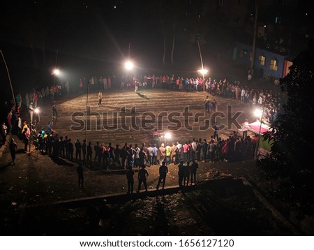 Local Stadium for cricket match.People around the playground in Night of top view. There are crowds around the middle of the night to watch the game.Top view and Arial photography.