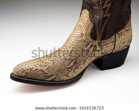 Cowboy boot made from the skin of a reticulated python (Malayopython reticulatus). The reticulated python is native to Asia. They are heavily exploited for their skin