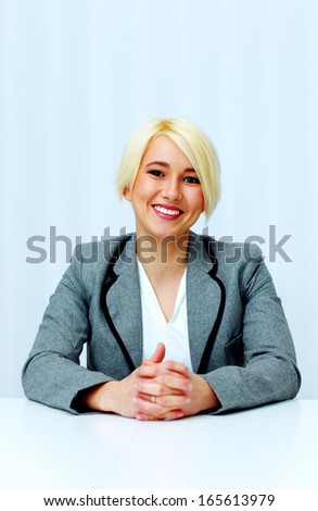 Young cheerful businesswoman in casual cloth isolated on a white background