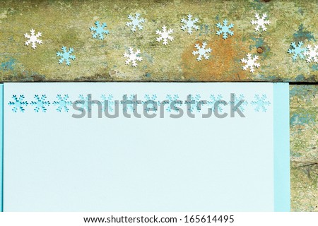 Christmas decoration ornament with snowflakes over wood background
