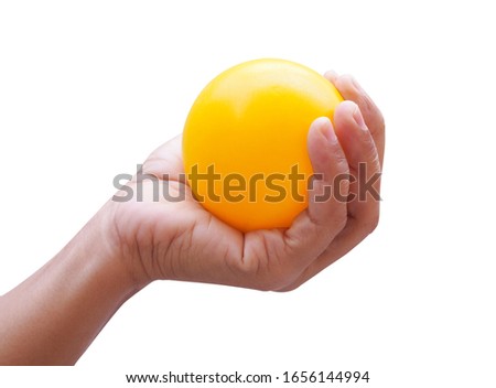 Hand exercise with squeezing yellow ball isolated on white background.
