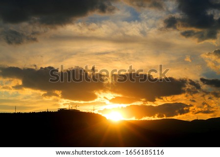 Photo of a beautiful sunset over the mountains in Tbilisi