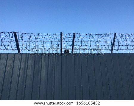 The barricade barbed wire at the airport.