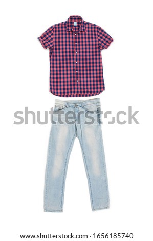 Blue jeans with plaid shirt short close up of checkered on white background
