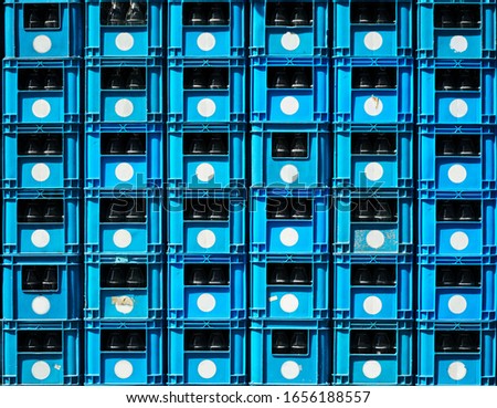 Water bottle crate stacked with empty glass bottle in storage Royalty-Free Stock Photo #1656188557