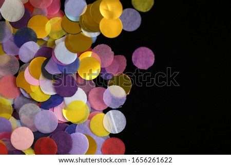 Confetti Background. Large multicolored  confetti on a black background.