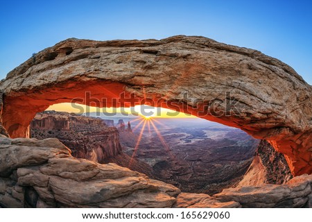 Famous sunrise at Mesa Arch in Canyonlands National Park, Utah, USA  Royalty-Free Stock Photo #165629060