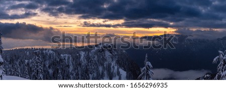 Canadian Nature Landscape covered in fresh white Snow during colorful and vibrant winter sunset. Taken in Seymour Mountain, North Vancouver, British Columbia, Canada. Panorama
