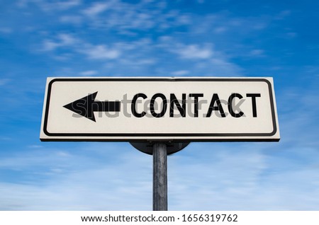 Contact road sign, arrow on blue sky background. One way blank road sign with copy space. Arrow on a pole pointing in one direction.