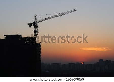 Construction site silhouettes in Beijing (China) after sunset 