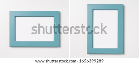 Design concept - top view of green wood photo frame isolated on white background for mockup, it's real photo, not 3D render