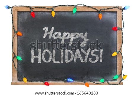 Happy Holidays hand drawn in white chalk on a black chalkboard surrounded with colorful lights isolated on white