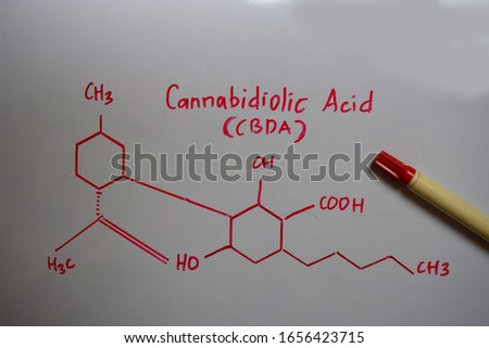 Cannabidiolic Acid (CBDA) molecule written on the white board. Structural chemical formula. Education concept