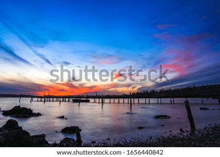 Beautiful sunset near the lake with vivid and colorful sky