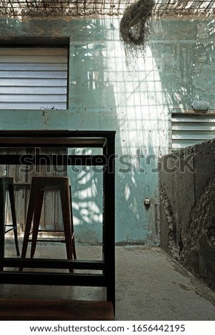 Soft focus of Interior design and decoration of industrial loft building decorated with concrete cement wall and metal table and chair set