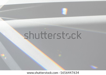 Blurred overlay effect for photo and mockups. Wall texture with organic drop diagonal shadow and rays of light from window on a white wall.