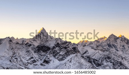 Sunrise above himalayan peaks. Cover sized photo. Beautiful high mountains landscape.