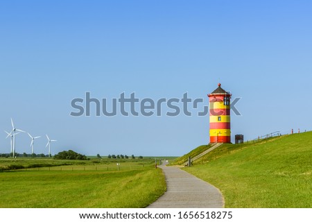 Famous Pilsum Lighthouse with Clear Blue Sky in East Frisia Near Greetsiel, Lower Saxony, Germany   Royalty-Free Stock Photo #1656518275