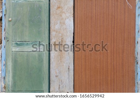 Background and texture photography of a mixture of woods with different colors and old