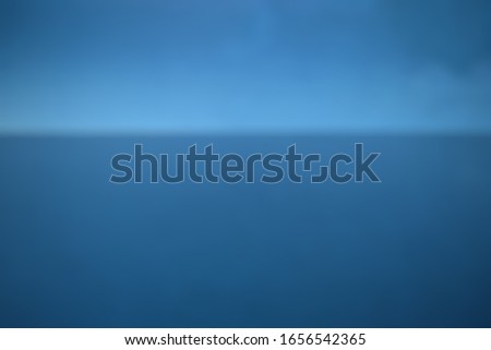 Blurred blue background with horizontal line.