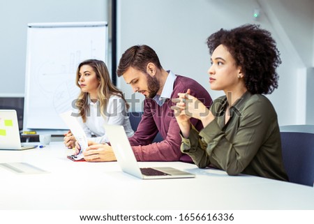Group of business people having meeting together.