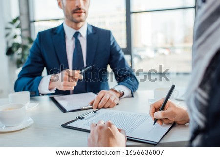 professional businessmen signing contract on meeting in modern office