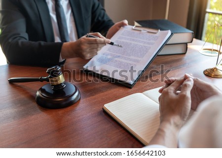 Male Notary lawyer or judge consult or discussing contract papers with Businessman client in office, Law and Legal services concept. Royalty-Free Stock Photo #1656642103