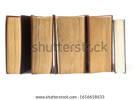 Old books with yellow pages isolated on white background