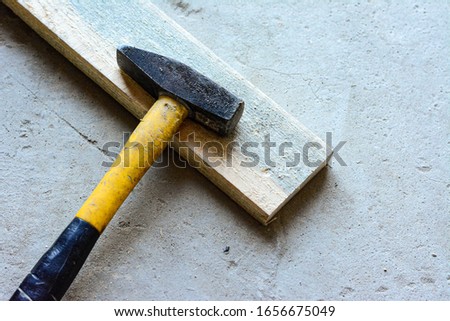 A slice lies on a boardwalk. Concrete floor hammer