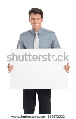 Portrait Of Happy Young Businessman Holding Blank Placard Isolated On White Background 