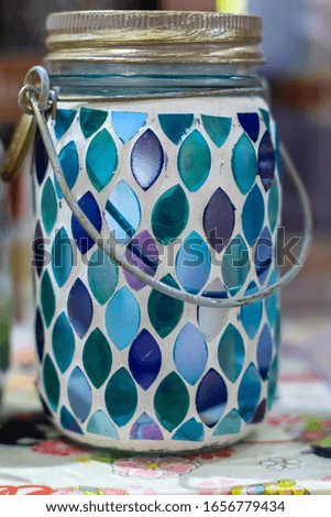 a mug with blue glass decoration