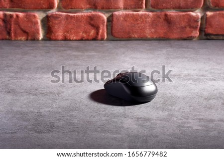 Computer mouse on the gray stone texture
