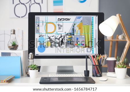 Comfortable workplace of interior designer in office Royalty-Free Stock Photo #1656784717
