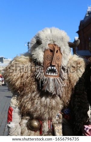 Moscow Maslenitsa Festival. Traditional national celebration in russian folk style. Slavic tradition. Holiday decor. Performance with masked artists on Manezhnaya Square in Moscow city, Russia. Mask