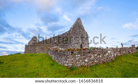 Fenaugh Abbey old religious ruins building structure rural countryside  landscape in North West Ireland panoramic landscape.