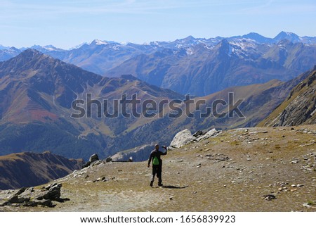 Man taking photos of mountains 

