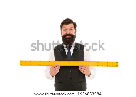 Learning metric system. School teacher. Size really matters. Man bearded hipster holding ruler. Measure length. Measure and control. Geometry theorem. Measure with centimeters. Size table concept.