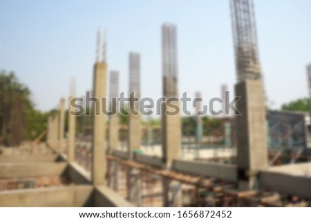 Blurred image of beams and columns of buildings under construction. construction site.