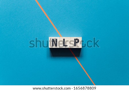 NLP - Neuro Linguistic Programming word concept on cubes
