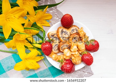 strawberries, cookies hearts, yellow flowers daffodils for Valentine mother woman Easter day with love together with a place for text