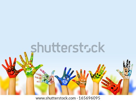Image of human hands in colorful paint with smiles Royalty-Free Stock Photo #165696095