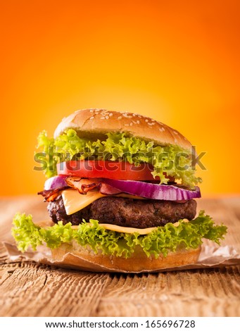 Delicious hamburger on wood