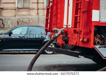 Hoses to quench the fire connecting with water pump valves of fire truck