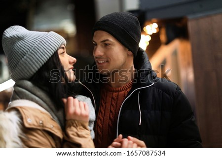 Lovely couple on city street. Winter vacation