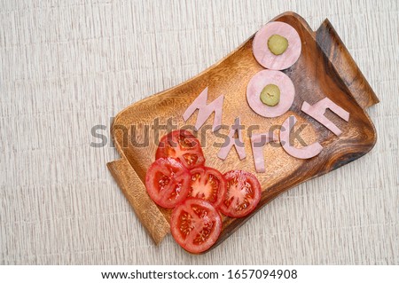 March 8. Number 8 on wooden board. international women day. sausage as a figure eight on wooden board