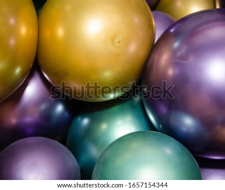 closeup of balloons gold purple and green for mardi gras party or celebration